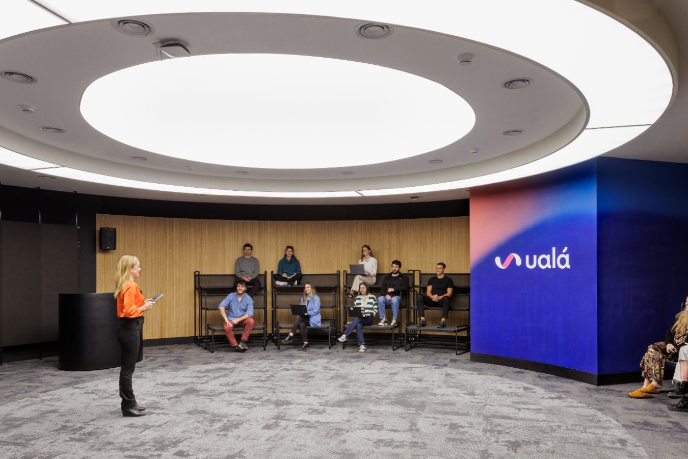 Uala Offices 2024 - Corporate town hall space with tiered seating and circular lighting for company events - Contract Workplaces.jpg